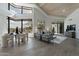 Open-concept living space with modern furnishings, a dining area, and expansive windows at 39493 N 107Th Way, Scottsdale, AZ 85262