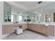 Spa-like main bathroom with double vanity, sleek fixtures, and mirrors, creating a luxurious and functional space at 39493 N 107Th Way, Scottsdale, AZ 85262