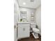 Modern bathroom with white cabinets, marble countertop, and gold accents at 4726 E Grandview Rd, Phoenix, AZ 85032