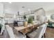 Bright dining room features a live edge table and modern chandelier at 4726 E Grandview Rd, Phoenix, AZ 85032