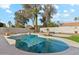 Inviting kidney-shaped pool with surrounding landscaping at 4726 E Grandview Rd, Phoenix, AZ 85032