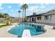 Relaxing kidney-shaped pool with diving board and a rubber duck at 4726 E Grandview Rd, Phoenix, AZ 85032