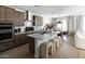 Modern kitchen island with seating and stainless steel appliances at 4831 S Molly --, Mesa, AZ 85212