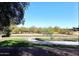 Landscaped backyard with walking path and trees at 5122 E Shea Blvd # 1005, Scottsdale, AZ 85254