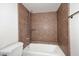 Clean bathroom with brown tile, shower/tub combo at 5122 E Shea Blvd # 1005, Scottsdale, AZ 85254