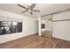 Bright bedroom with ceiling fan, mirrored closet, and wood floors at 5122 E Shea Blvd # 1005, Scottsdale, AZ 85254