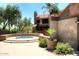 Relax in the community hot tub, complete with surrounding landscaping at 5122 E Shea Blvd # 1005, Scottsdale, AZ 85254