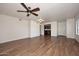 Living room with kitchen view and wood floors at 5122 E Shea Blvd # 1005, Scottsdale, AZ 85254