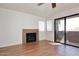 Living room with fireplace and patio doors at 5122 E Shea Blvd # 1005, Scottsdale, AZ 85254