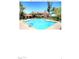 Community pool with lounge chairs and seating at 5122 E Shea Blvd # 1005, Scottsdale, AZ 85254