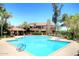 Inviting community pool with lounge chairs and shade at 5122 E Shea Blvd # 1005, Scottsdale, AZ 85254