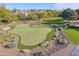 Backyard showcasing a custom putting green with sand trap, set against manicured landscaping at 5203 N Monte Vista Dr, Paradise Valley, AZ 85253