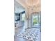 Foyer with tile floor, chandelier, and view into the dining room and front yard at 5203 N Monte Vista Dr, Paradise Valley, AZ 85253