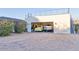 Spacious garage with a sunny yellow antique truck parked inside and large brick driveway at 5203 N Monte Vista Dr, Paradise Valley, AZ 85253