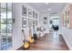 Stylish hallway with wood floors, shiplap walls, and an array of guitars and framed artwork at 5203 N Monte Vista Dr, Paradise Valley, AZ 85253