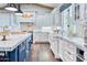 A spacious kitchen featuring two islands, stainless steel appliances, and white and blue cabinets at 5203 N Monte Vista Dr, Paradise Valley, AZ 85253