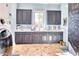 Well-organized laundry room with navy blue cabinets, bright countertops, and a functional design at 5203 N Monte Vista Dr, Paradise Valley, AZ 85253