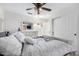 Bedroom with ceiling fan, dresser, and sliding door to closet at 5748 W Soft Wind Dr, Glendale, AZ 85310