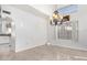 Elegant dining room featuring a chandelier and large window at 5748 W Soft Wind Dr, Glendale, AZ 85310