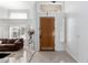 Bright entryway with high ceilings and wood door at 5748 W Soft Wind Dr, Glendale, AZ 85310