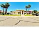 Inviting home with lush landscaping and a well-manicured lawn, under a clear blue sky at 5748 W Soft Wind Dr, Glendale, AZ 85310