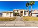 Two-story house with landscaped yard and palm trees at 5748 W Soft Wind Dr, Glendale, AZ 85310