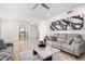 Bright and airy Gathering room with gray sofas and a large window at 5748 W Soft Wind Dr, Glendale, AZ 85310