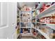 Well-stocked pantry with ample shelving for storage at 5748 W Soft Wind Dr, Glendale, AZ 85310