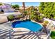 Inviting kidney-shaped pool with waterfall feature and pergola at 5748 W Soft Wind Dr, Glendale, AZ 85310