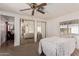 Spacious bedroom with mirrored closet doors and a ceiling fan at 6960 W Peoria Ave # 171, Peoria, AZ 85345