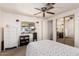 Well-lit bedroom with mirrored closet and ceiling fan at 6960 W Peoria Ave # 171, Peoria, AZ 85345