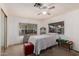 Comfortable bedroom with ceiling fan and dresser at 6960 W Peoria Ave # 171, Peoria, AZ 85345