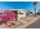 Mobile home with pink flowers at 6960 W Peoria Ave # 171, Peoria, AZ 85345