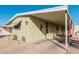 Mobile home with carport and red door at 6960 W Peoria Ave # 171, Peoria, AZ 85345