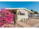 Mobile home with pink flowers at 6960 W Peoria Ave # 171, Peoria, AZ 85345