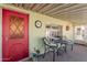 Covered front porch with red door and seating at 6960 W Peoria Ave # 171, Peoria, AZ 85345