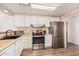 Bright kitchen features stainless steel appliances and ample cabinetry at 6960 W Peoria Ave # 171, Peoria, AZ 85345