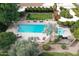 Aerial view of sparkling pool with lounge chairs and manicured greenery at 6960 W Peoria Ave # 171, Peoria, AZ 85345