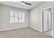 Well-lit bedroom with window shutters and ceiling fan at 755 E Zion Dr # 103, Gilbert, AZ 85297