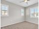 Bright bedroom featuring neutral walls, carpet, and window shutters at 755 E Zion Dr # 103, Gilbert, AZ 85297