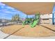 Community playground with shade structure and wood chips at 755 E Zion Dr # 103, Gilbert, AZ 85297