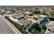 Aerial view of a house with a pool, surrounded by lush greenery and other homes at 8308 W Avenida Del Sol --, Peoria, AZ 85383