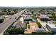 An aerial view of a house with a pool, situated near a busy road and other houses at 8308 W Avenida Del Sol --, Peoria, AZ 85383