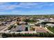 Aerial view of a house with a pool and large backyard, showcasing its location in a residential neighborhood at 8308 W Avenida Del Sol --, Peoria, AZ 85383