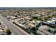 An aerial view showcasing a house with a pool and ample yard space, near a main road at 8308 W Avenida Del Sol --, Peoria, AZ 85383