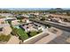 Aerial photo of a house with a pool and solar panels, in a quiet neighborhood setting at 8308 W Avenida Del Sol --, Peoria, AZ 85383