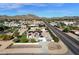 Aerial view of a single-story house with solar panels, a pool, and a gated entrance at 8308 W Avenida Del Sol --, Peoria, AZ 85383