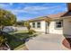 View of the home's backyard, showcasing a grassy area and patio at 8308 W Avenida Del Sol --, Peoria, AZ 85383