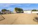 Large gravel backyard with detached garage and mature trees at 8308 W Avenida Del Sol --, Peoria, AZ 85383