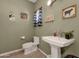 Charming half bathroom with pedestal sink and rustic decor at 8308 W Avenida Del Sol --, Peoria, AZ 85383